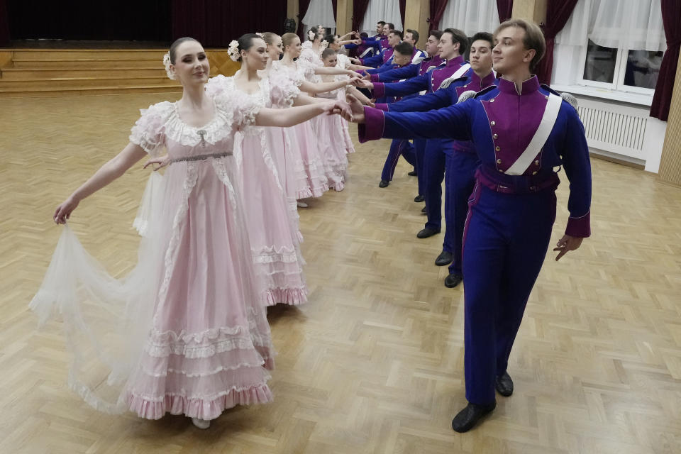 Dancers of the WARSZAWIANKA ensemble of the University of Warsaw dance Poland's national polonaise dance in 18th century costumes during dress rehearsal in Warsaw, Poland, on Feb. 8, 2024. Once banned by rulers dispatched from Moscow, Poland's stately polonaise dance that nurtured the country's spirit even through the dark years of its partition is now honored by the United Nations' education and culture agency, UNESCO. (AP Photo/Czarek Sokolowski)