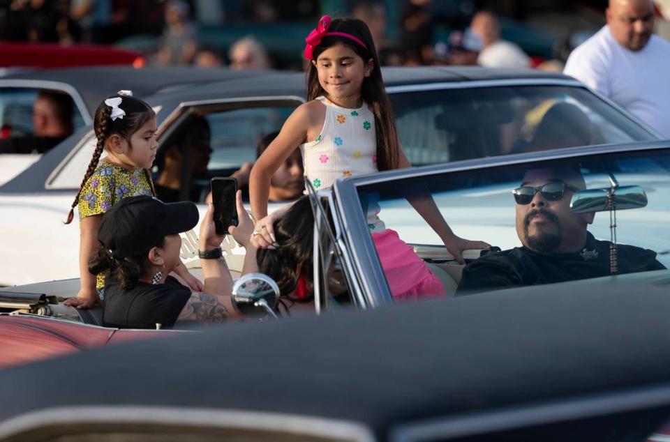 Classic car owners cruise down McHenry Avenue during the Graffiti Parade in Modesto, Calif., Friday, June 9, 2023. Andy Alfaro/aalfaro@modbee.com