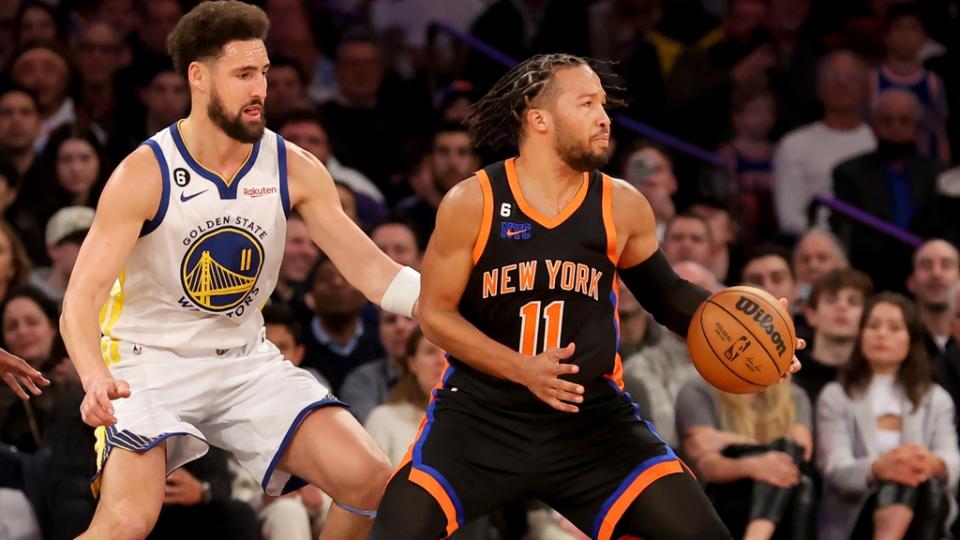 New York Knicks guard Jalen Brunson (11) controls the ball against Golden State Warriors guard Klay Thompson (11) during the first quarter at Madison Square Garden