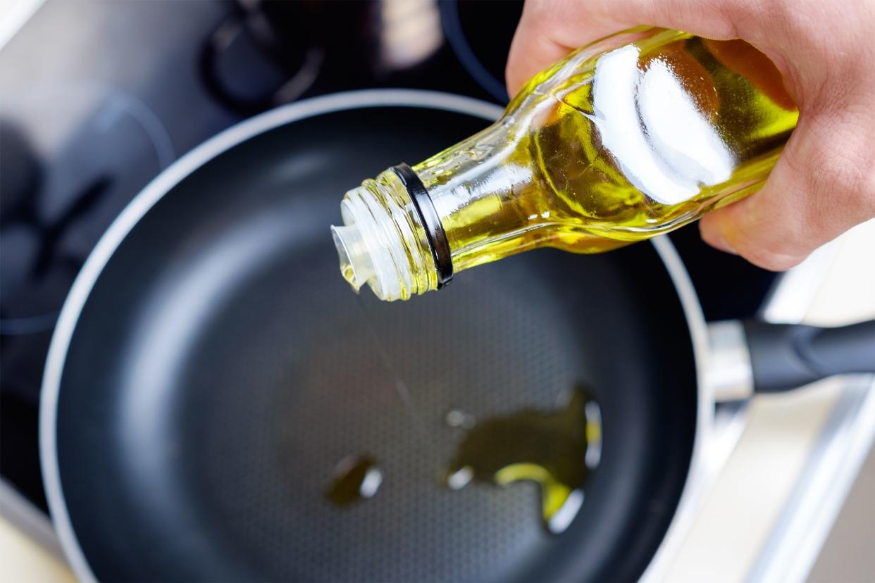 Pouring oil into a pan