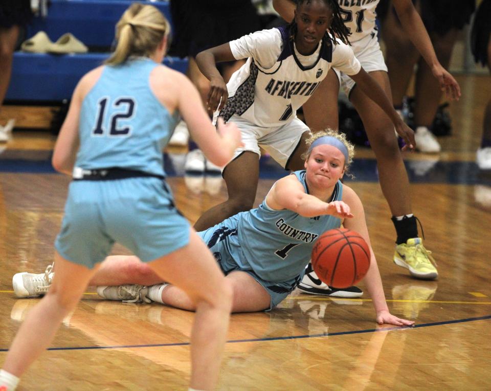 CCD senior Sam Easter fights for the ball as Cincinnati Country Day lost 61-50 to Columbus Africentric in an OHSAA Division III girls basketball regional semifinal March 6, 2024 at Springfield High School.