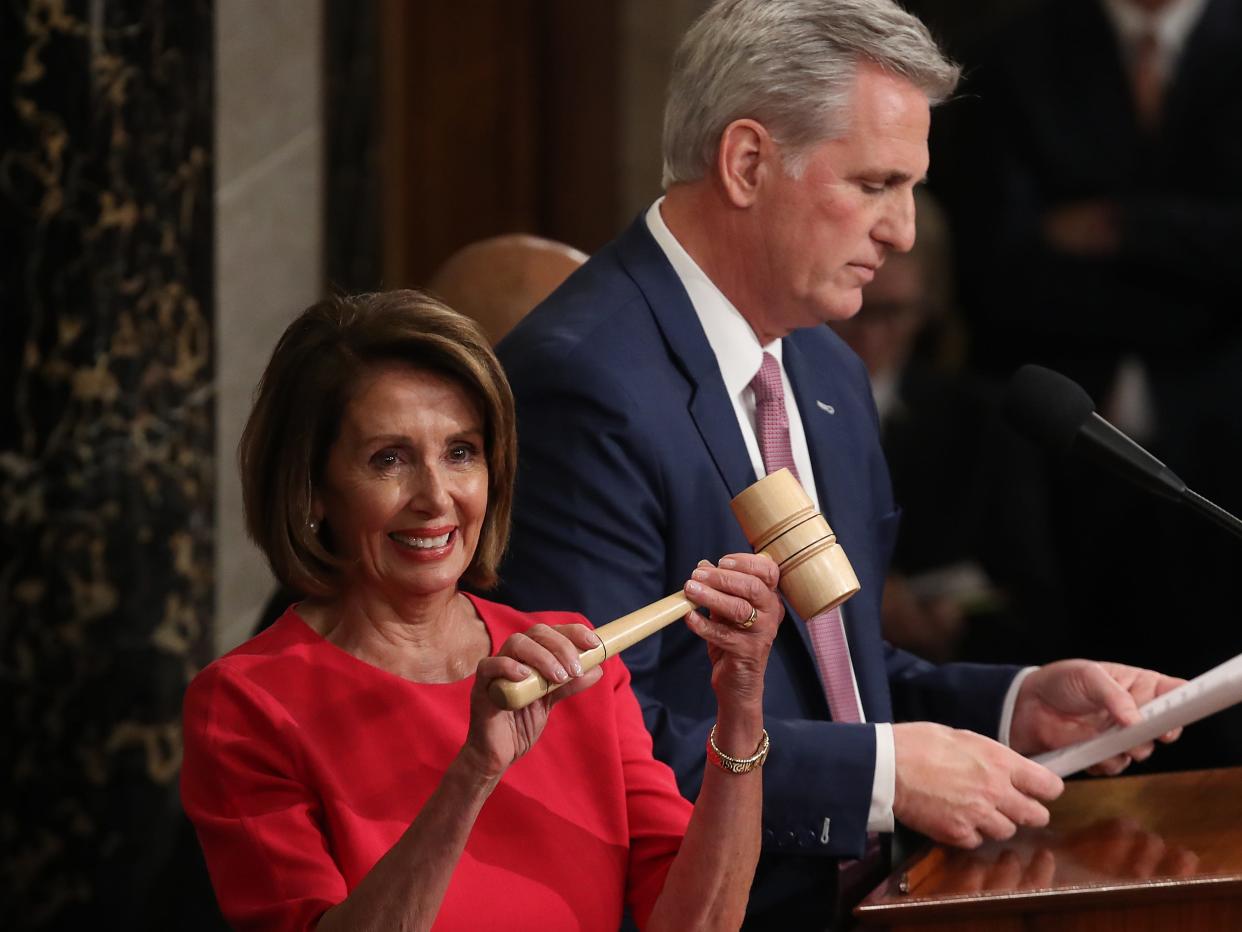 Pelosi holds gavel next to Kevin McCarthy