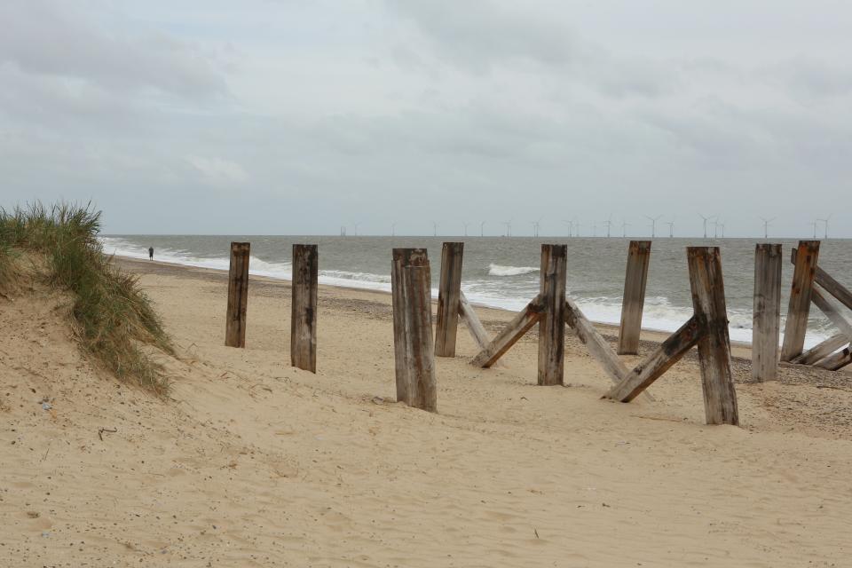 Great Yarmouth Central Beach in Great Yarmouth, Norfolk, with Scroby Sands offshore wind farm visible on the horizon. Picture date: Monday June 21, 2021. Photographer: Johnny Green