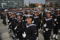 Polish troops sing the national anthem during a ceremony marking Polish Army Day in Warsaw, Poland, Monday, Aug. 15, 2022. The Polish president and other officials marked their nation's Armed Forces Day holiday Monday alongside the U.S. army commander in Europe and regular American troops, a symbolic underlining of NATO support for members on the eastern front as Russia wages war nearby in Ukraine. (AP Photo/Michal Dyjuk)