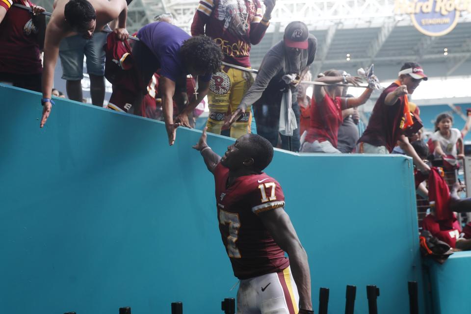 Washington Redskins wide receiver Terry McLaurin (17) greets fans at the end of an NFL football game against the Miami Dolphins, Sunday, Oct. 13, 2019, in Miami Gardens, Fla. The Redskins defeated the Dolphins 17-16. McLaurin scored two touchdowns. (AP Photo/Brynn Anderson)