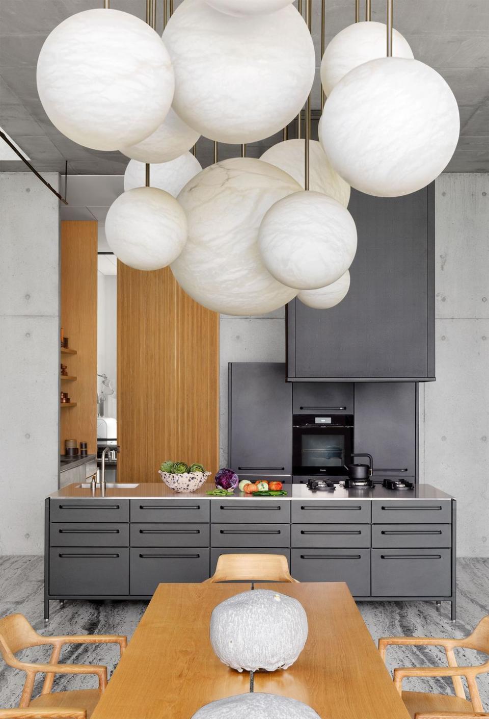 a kitchen with a table and chairs