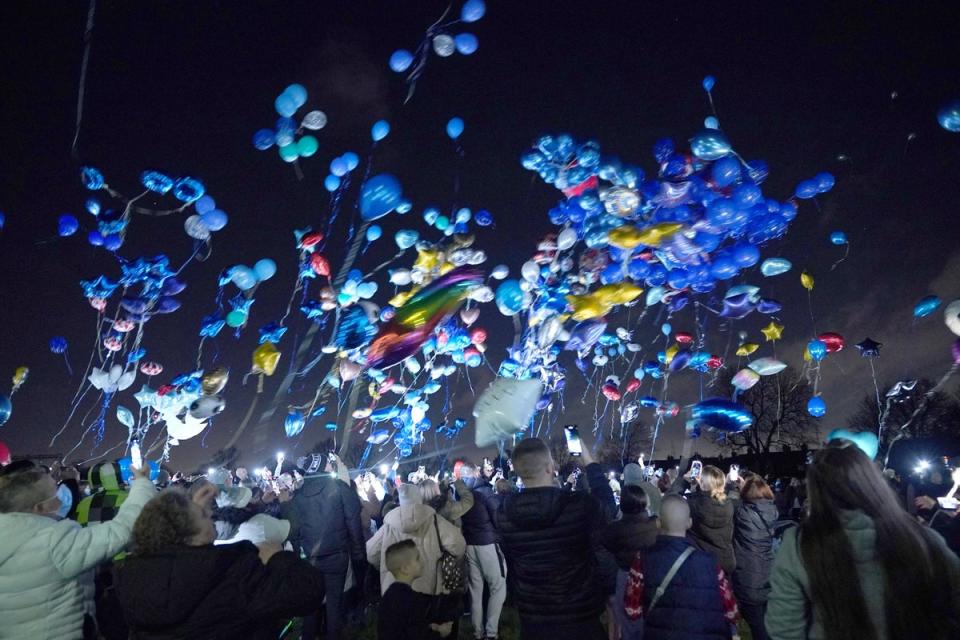 People release balloons in Sutton, in memory of the four brothers (PA Wire)