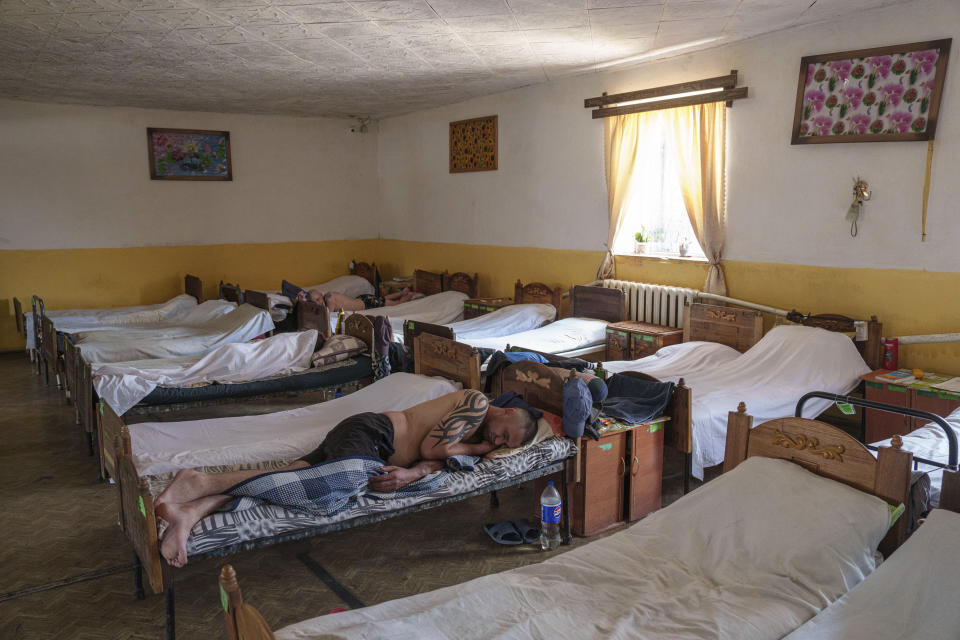 Prisoners sleep on beds in the barracks in a prison, in the Dnipropetrovsk region, Ukraine, Friday, June 21, 2024. Ukraine is expanding its military recruiting to cope with battlefield shortages more than two years into fighting Russia’s full-scale invasion. (AP Photo/Evgeniy Maloletka)