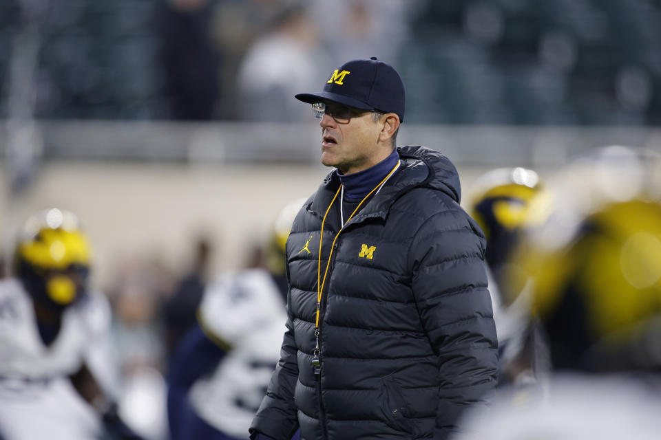 Michigan coach Jim Harbaugh continues to deny knowledge of illegal in-person sign-stealing within his program amid an NCAA investigation. (AP Photo/Al Goldis)
