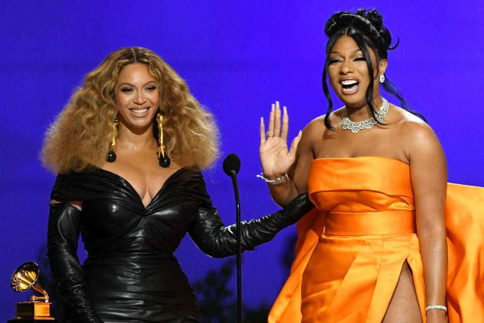 <p>Kevin Winter/Getty</p> Beyonce and Megan Thee Stallion accept the best rap performance award for 