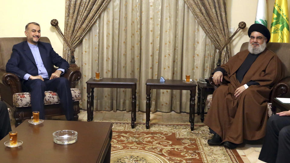 In this picture released by the Hezbollah Media Relations Office, Hezbollah leader Sayyed Hassan Nasrallah, right, meets with Iranian Foreign Minister Hossein Amirabdollahian in Beirut, Lebanon, Friday, Jan. 13, 2023. Amirabdollahian said talks between regional rivals Iran and Saudi Arabia are continuing and could eventually restore diplomatic relations that were severed years ago. (Hezbollah Media Relations Office, via AP)