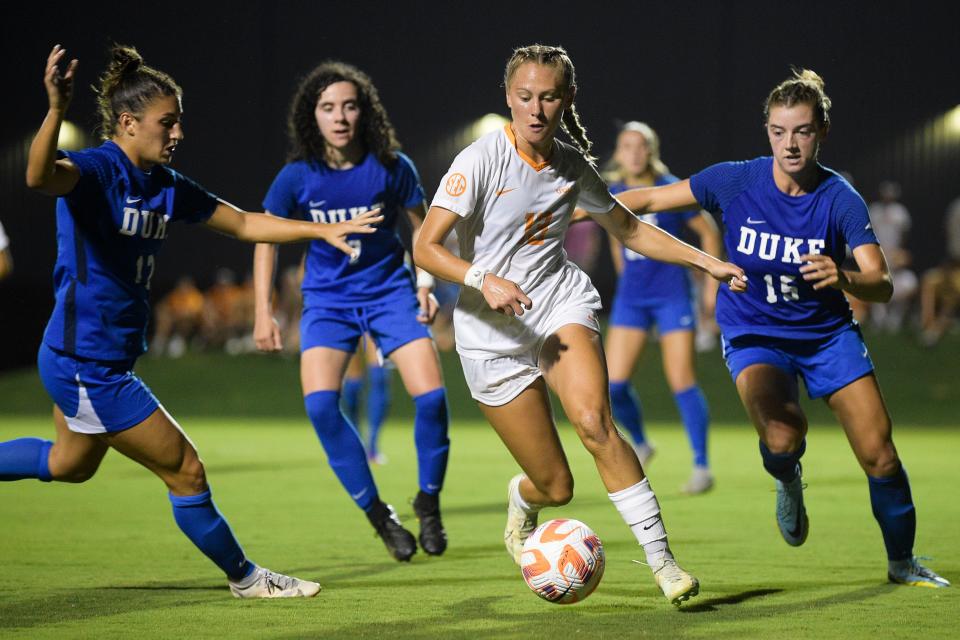 Tennessee midfielder/forward Taylor Huff (13) dribbles past Duke defenders during a game between Duke and Tennessee at Regal Soccer Stadium in Knoxville, Tenn. on Thursday, Aug. 25, 2022.