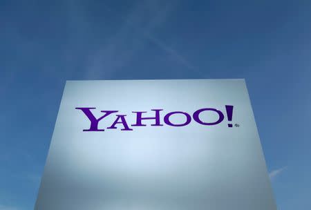 A Yahoo logo is pictured in front of a building in Rolle, east of Geneva, Switzerland December 12, 2012. REUTERS/Denis Balibouse/File Photo