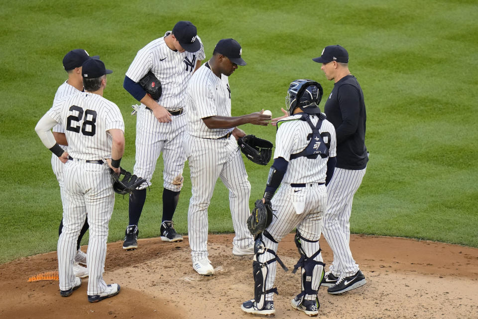New York Yankees starting pitcher Luis Severino hands the ball to manager Aaron Boone during the third inning of the team's baseball game against the Baltimore Orioles on Thursday, July 6, 2023, in New York. (AP Photo/Frank Franklin II)