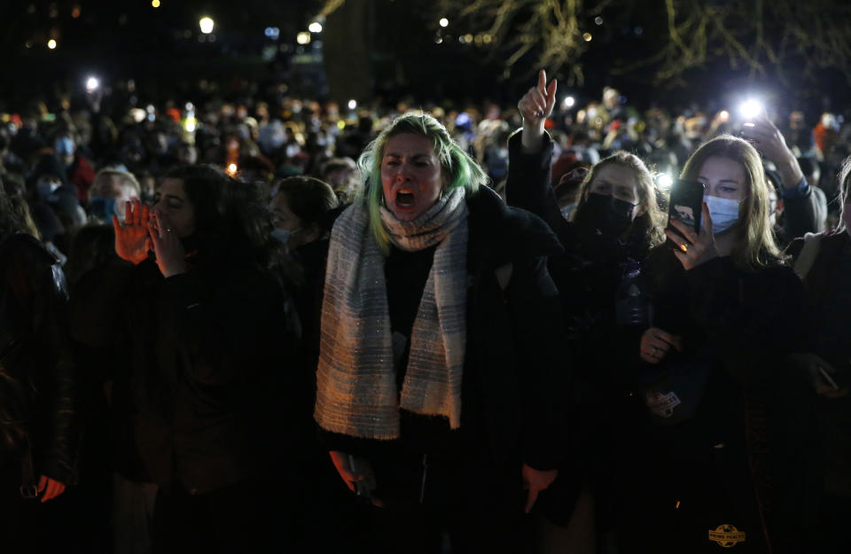 LONDON, ENGLAND - MARCH 13: Members of the public shout during a vigil for Sarah Everard on Clapham Common on March 13, 2021 in London, United Kingdom. Vigils are being held across the United Kingdom in memory of Sarah Everard. Yesterday, the Police confirmed that the remains of Ms Everard were found in a woodland area in Ashford, a week after she went missing as she walked home from visiting a friend in Clapham. Metropolitan Police Officer Wayne Couzens has been charged with her kidnap and murder. (Photo by Hollie Adams/Getty Images)