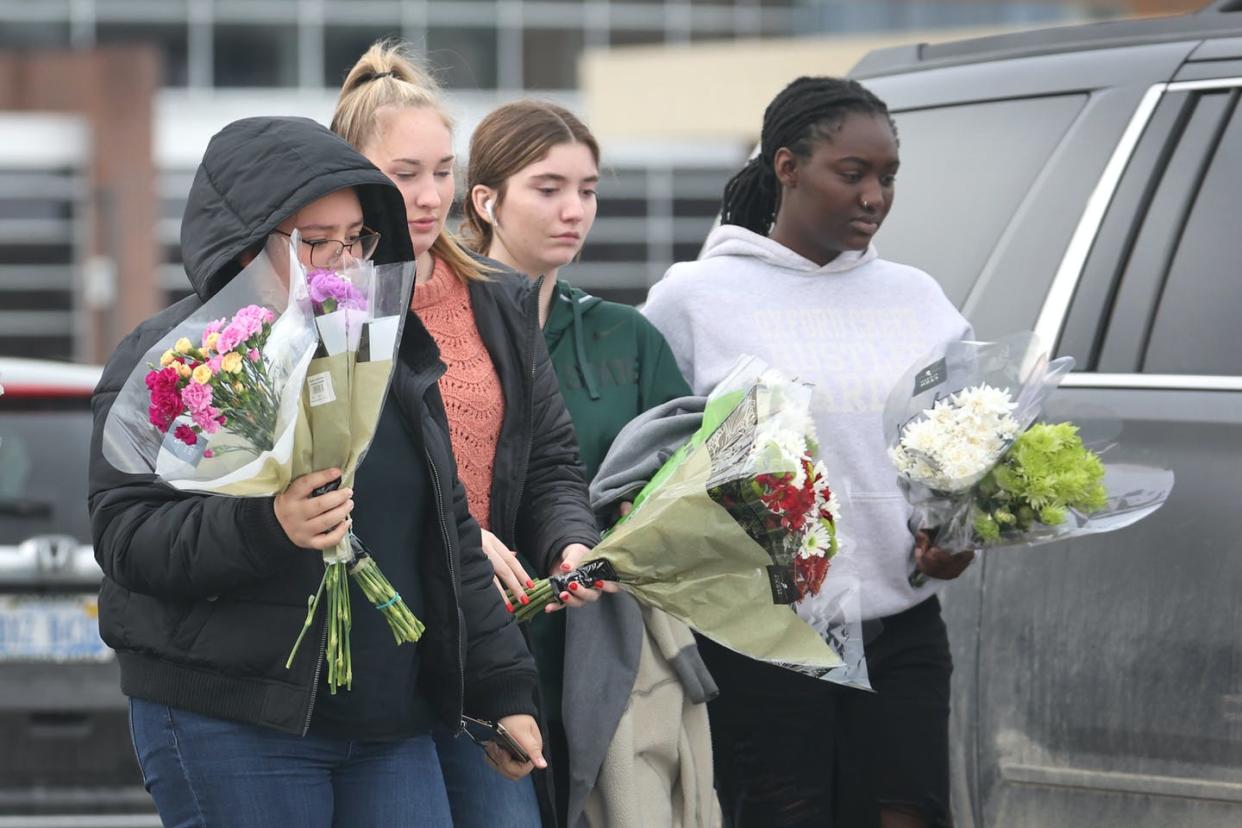 <span class="caption">So far, there have been 222 school shootings in 2021.</span> <span class="attribution"><a class="link " href="https://www.gettyimages.com/detail/news-photo/people-bring-flowers-to-a-makeshift-memorial-outside-of-news-photo/1356625412?adppopup=true" rel="nofollow noopener" target="_blank" data-ylk="slk:Scott Olson/Getty Images;elm:context_link;itc:0;sec:content-canvas">Scott Olson/Getty Images</a></span>