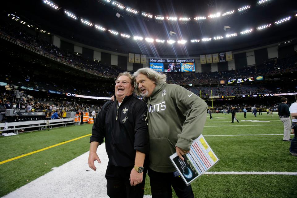 Former New Orleans Saints defensive coordinator Rob Ryan, right, walks of the field with former Saints defensive line coach Bill Johnson after a game against the Dallas Cowboys on Nov. 10, 2013.