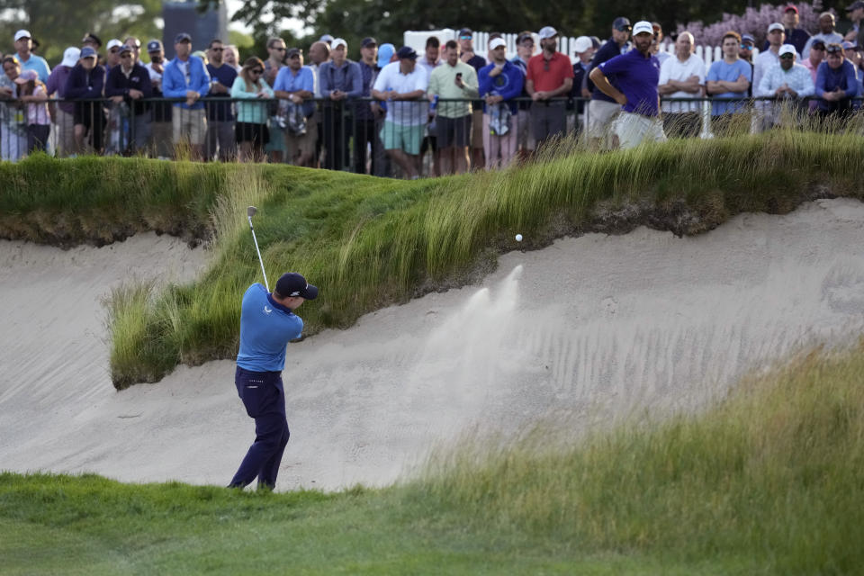 Matthew Fitzpatrick, of England, hits on the 18th hole during the first round of the U.S. Open golf tournament at The Country Club, Thursday, June 16, 2022, in Brookline, Mass. (AP Photo/Charlie Riedel)