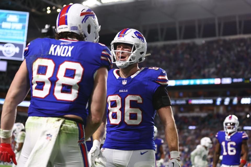 Dawson Knox #88 of the Buffalo Bills celebrates with Dalton Kincaid #86 after a touchdown during the fourth quarter against the Miami Dolphins at Hard Rock Stadium on January 07, 2024 in Miami Gardens, Florida.