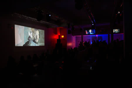 The final episode of Game of Thrones is projected at a watch party in the Manhattan borough of New York City, U.S., May 19, 2019. REUTERS/Caitlin Ochs