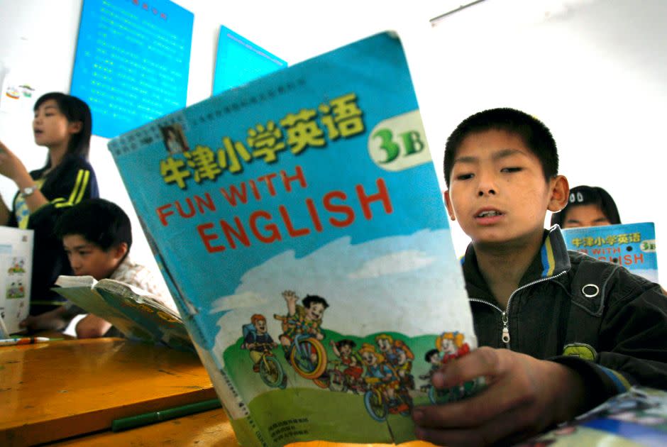 Students learn English during a class at a Wushu school in Longtan county