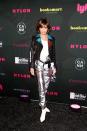 <p>Lisa Rinna is pulling off an '80s trifecta with the graffiti jacket, metallic pants, and belt bag. Not an easy feat! </p>