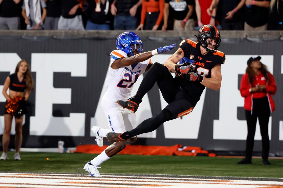 Oregon State Beavers tight end Luke Musgrave (88) makes a catch in the end zone for a touchdown while being defended by Boise State Broncos cornerback Tyreque Jones (21) during the first half at Reser Stadium Sept. 3, 2022, in Corvallis.
