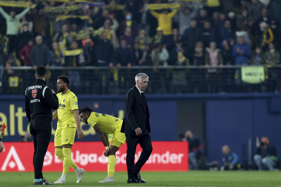 Real Madrid's head coach Carlo Ancelotti leaves the pitch after the Spanish La Liga soccer match between Villareal and Real Madrid at Estadio De La Ceramica in Villareal, eastern Spain, Saturday, Jan. 7, 2023. Villareal won 2-1. (AP Photo/Alberto Saiz)