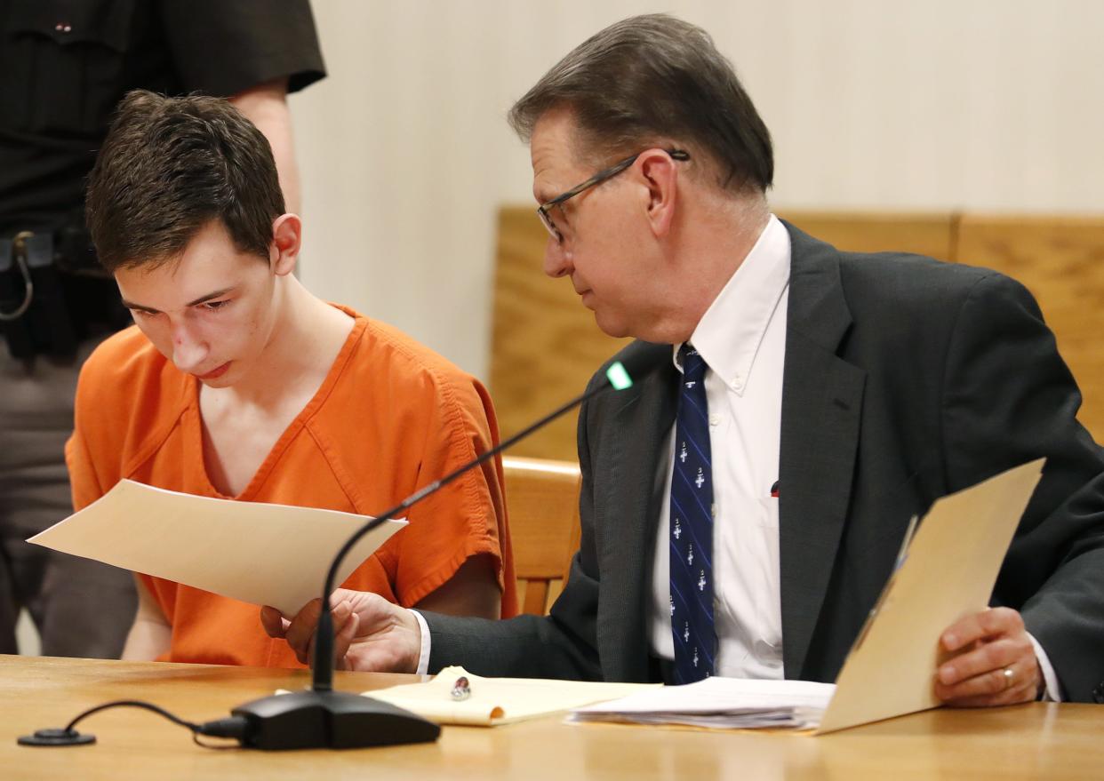 Alexander Kraus appears in court in 2019 with his attorney, Gregory Petit, after he was charged with two counts of first-degree intentional homicide in the deaths of his grandparents, Dennis L. Kraus, 74, and Letha G. Kraus, 73.