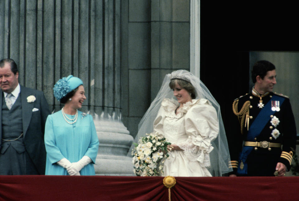 <p>The Queen laughs with Princess Diana on the balcony of Buckingham Palace after her wedding to Charles on 29 July 1981. (Getty Images)</p> 