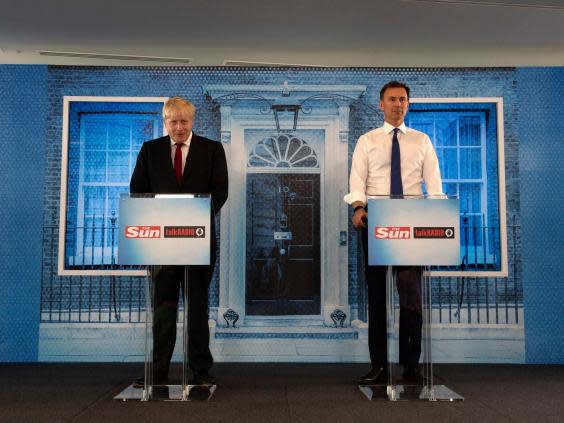 Conservative party leadership candidates Boris Johnson and Jeremy Hunt during a debate hosted by The Sun at Talk Radio in The News Building, London 15 July 2019. (Louis Wood/The Sun/PA)