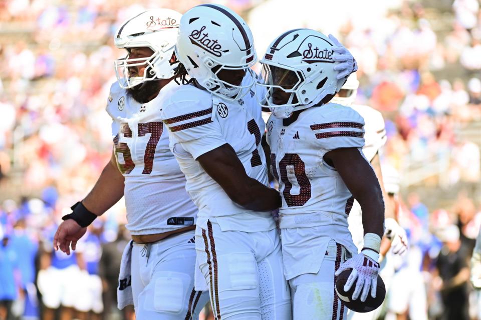 Mississippi State running back Johnnie Daniels, right, celebrates his touchdown with teammates during last Saturday's loss to Florida. The Bulldogs have an even tougher matchup this week at Texas, which should have more than 100,000 fans at Royal-Memorial Stadium cheering for a 5-0 start.