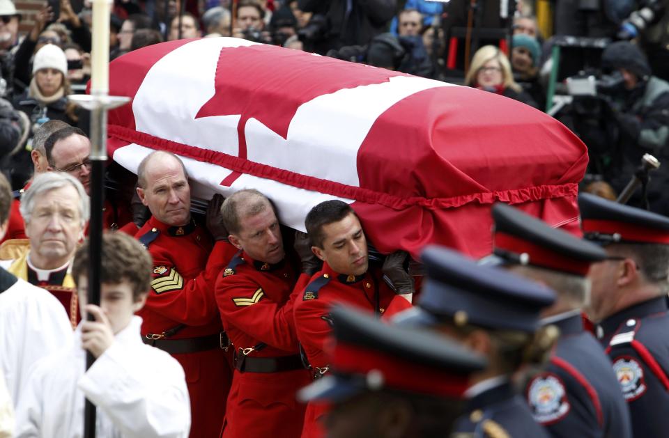 The casket of Canada's former finance minister Jim Flaherty arrives at St. James Cathedral for his state funeral in Toronto, April 16, 2014.