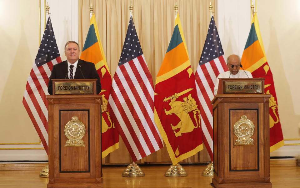 U.S. Secretary of State Mike Pompeo and Sri Lankan Foreign Minister Dinesh Gunawardena attend a joint press briefing in Colombo, Sri Lanka, Wednesday, Oct. 28, 2020. Pompeo plans to press Sri Lanka to push back against Chinese assertiveness, which U.S. officials complain is highlighted by predatory lending and development projects that benefit China more than the presumed recipients. The Chinese Embassy in Sri Lanka denounced Pompeo’s visit to the island even before he arrived there, denouncing a senior U.S. official’s warning that the country should be wary of Chinese investment. (AP Photo/Eranga Jayawardena)