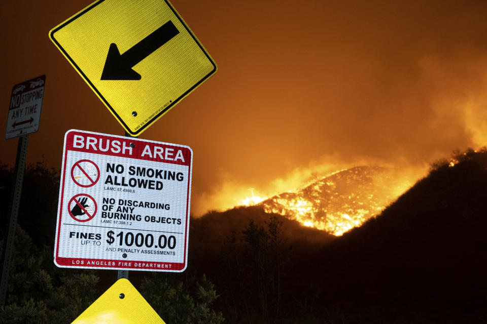 Flames from a wildfire burn along the hills north of Sesnon Boulevard, Friday morning, Oct. 11, 2019, in Porter Ranch, Calif. (Photo: David Crane/The Orange County Register via AP)