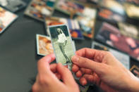 Crystal Deckard looks over an old photograph of her mother Darlene Coker as she reminisces over her mother's life in California, U.S. August 15, 2018. REUTERS/Mike Blake