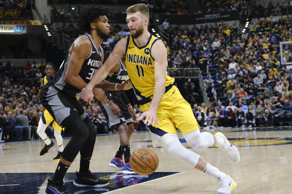 Indiana Pacers forward Domantas Sabonis (11) goes around Sacramento Kings forward Marvin Bagley III (35) during the second half of an NBA basketball game in Indianapolis, Friday, Dec. 20, 2019. The Pacers won 119-105. (AP Photo/AJ Mast)