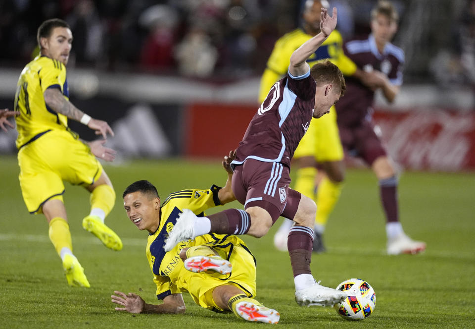 Nashville SC midfielder Sean Davis, front left, becomes entangled with Colorado Rapids midfielder Connor Ronan, front right, during the first half of an MLS soccer match Saturday, March 2, 2024, in Commerce City, Colo. (AP Photo/David Zalubowski)