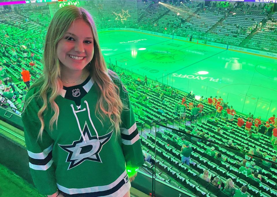 Before Game 4 of the Stanley Cup series between Dallas and Calgary, American Airlines Center was bathed in green light. Many fans wore Stars jerseys; a few Flames fans in red can be seen near their players' box.