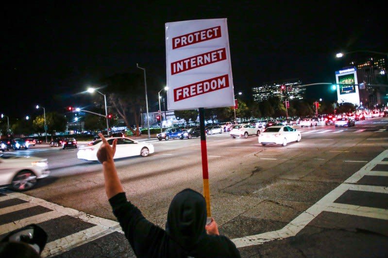 Supporter of Net Neutrality Lance Brown Eyes protests the FCC's recent decision to repeal the program in Los Angeles, California, November 28, 2017. REUTERS/ Kyle Grillot