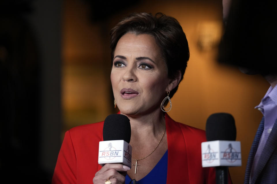 Kari Lake speaks during a television interview before Republican presidential candidate former President Donald Trump speaks during a campaign event in Laconia, N.H., Monday, Jan. 22, 2024. (AP Photo/Matt Rourke)