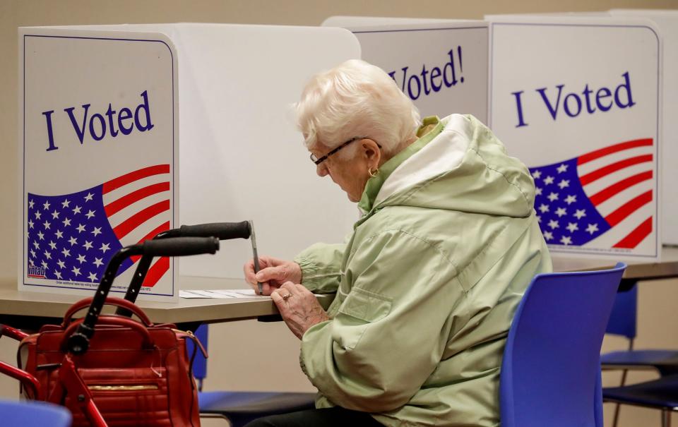 Betty Maurer casts her ballot at the Mead Library poll, Tuesday, November 8, 2022, in Sheboygan, Wis.