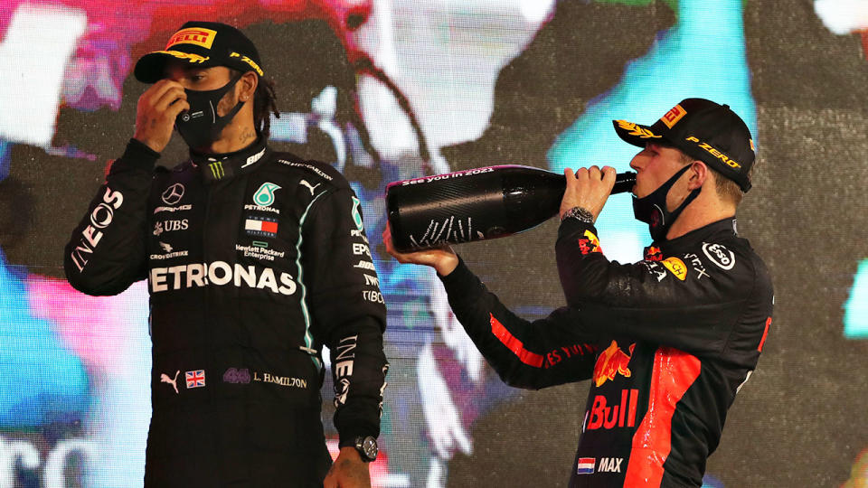 Pictured here, Lewis Hamilton shares the podium with Abu Dhabi GP winner Max Verstappen.