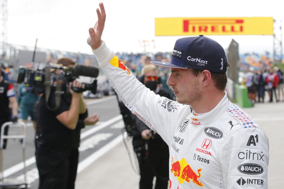 Red Bull driver Max Verstappen of the Netherlands waves to the crowd as he walks from his car after qualifying Sunday's Formula One Turkish Grand Prix at the Intercity Istanbul Park circuit in Istanbul, Turkey, Saturday, Oct. 9, 2021. Verstappen will start in second place after Mercedes driver Lewis Hamilton of Britain who was fastest was give a 10 place penalty with Hamiton';s teammate Mercedes driver Valtteri Bottas of Finland now on pole. (Umit Bektas/Pool Photo via AP)