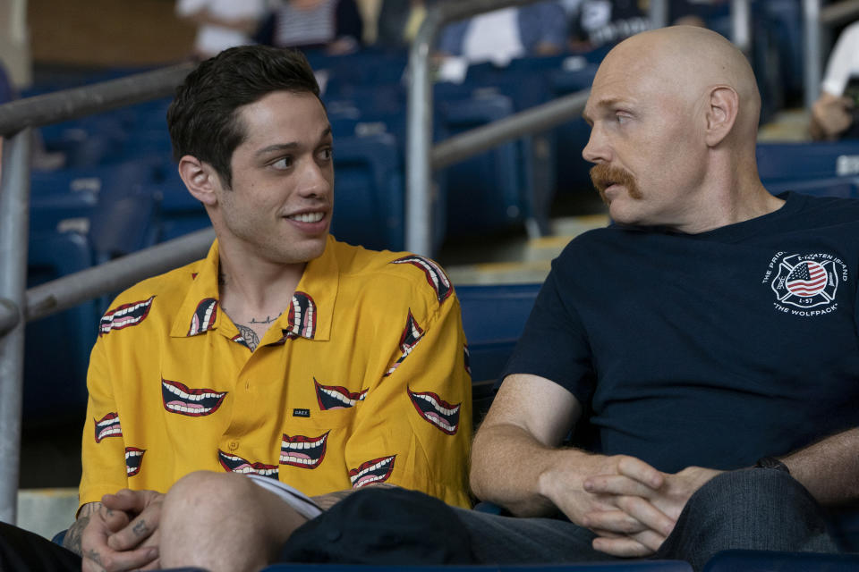 In this image released by Universal Pictures, Pete Davidson, left, and Bill Burr appear in a scene from "The King of Staten Island," directed by Judd Apatow. (Mary Cybulski/Universal Pictures via AP)