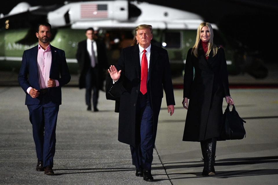 President Donald Trump, Ivanka Trump and Donald Trump Jr. make their way to board Air Force One before departing from Dobbins Air Reserve Base in Marietta, Georgia on Jan. 4, 2021.