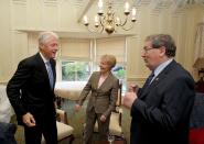 FILE PHOTO: Former U.S. President Bill Clinton greets former SDLP leader, John Hume and his wife Pat, in Londonderry, Northern Ireland