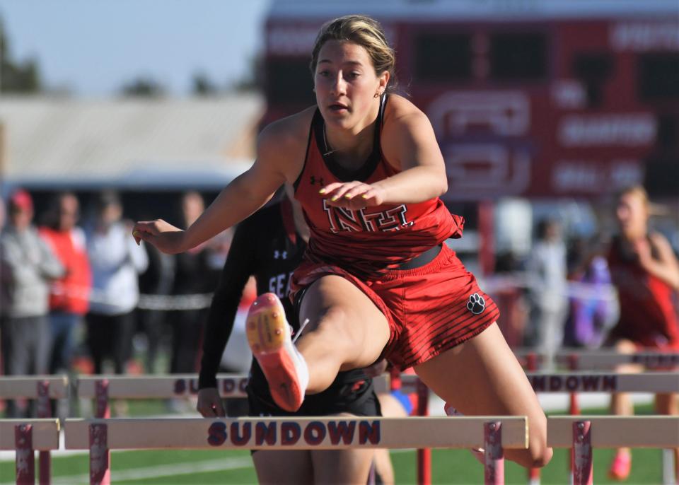 New Home's Sydney Snell competes in the girls 100-meter hurdles at the District 5-2A track meet Thursday, April 6, 2023, at Slaughter Field in Sundown.