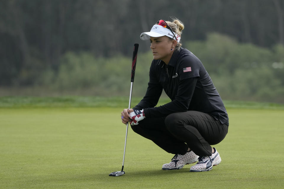 Lexi Thompson, of the United States, waits to putt on the 12th green at the International Crown match play golf tournament in San Francisco, Thursday, May 4, 2023. (AP Photo/Jeff Chiu)