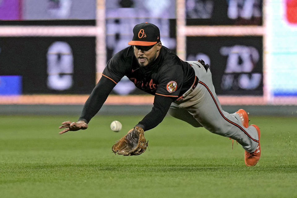 Baltimore Orioles right fielder Anthony Santander catches a ball for the out on Kansas City Royals' Bobby Witt Jr. during the ninth inning of a baseball game Saturday, April 20, 2024, in Kansas City, Mo. The Orioles won 9-7. (AP Photo/Charlie Riedel)